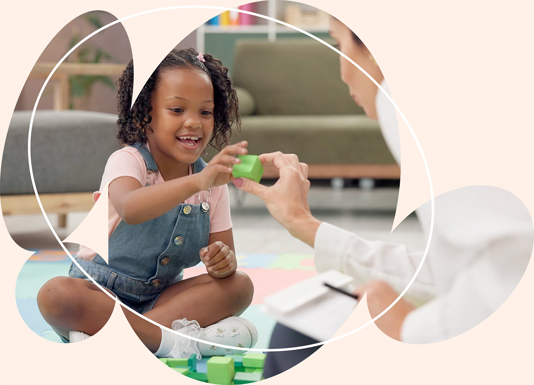 Therapist engaging child in hands on fine motor activity to improve coordination and problem solving skills